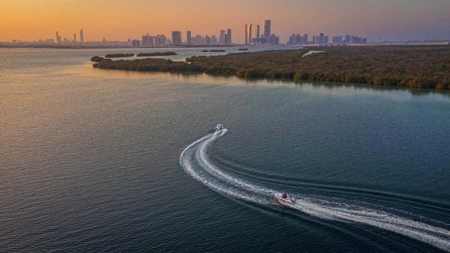 Abu Dhabi: Yas Island Self-Driving Guided Speedboat Tour - The Peninsula Gold Beach swim stop