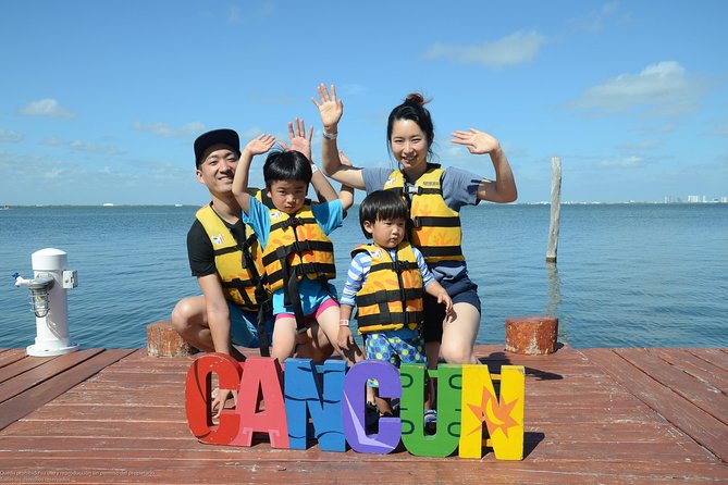 Cancun speedboat and snorkel tour: shared speedboat - Learning to handle the two-person speedboat