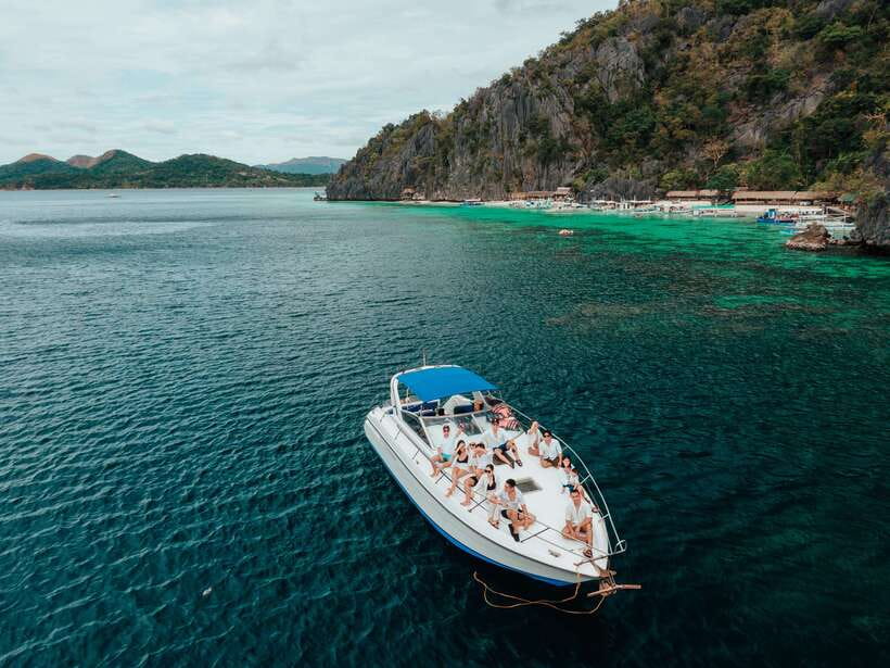 Coron: Private Island-Hopping Tour on a Yacht or Speedboat - Kayangan Lake: the postcard stop with a climb