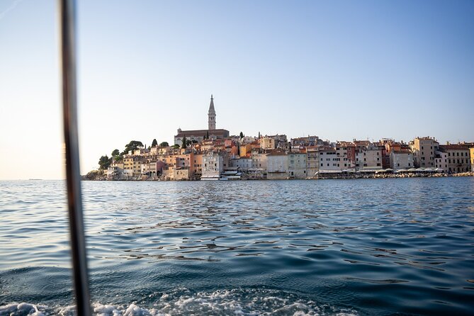 Dolphin Watching Sunset Speedboat Tour with Drinks in Rovinj - Returning with Rovinj’s old town in view