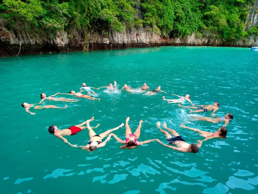 From Krabi: Phi Phi Early Bird & 4 Islands by Speedboat - Swimming inside Pileh Lagoon