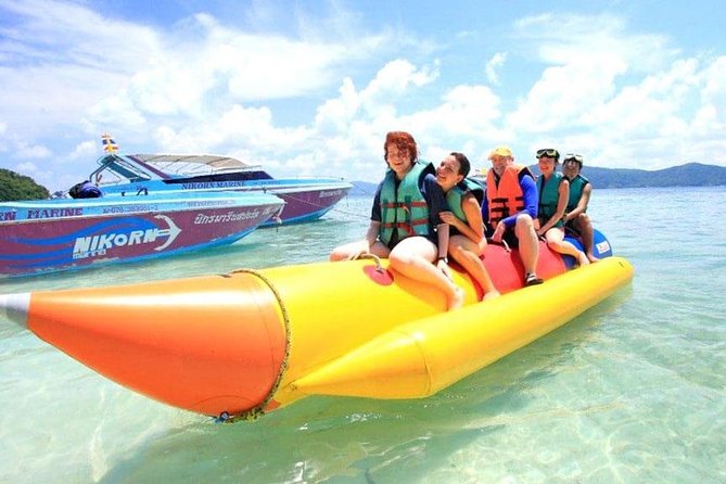 Full Day Coral Island Tour With Banana Boat By Speedboat From Phuket - Coral Island beach time, snorkeling, and sea life