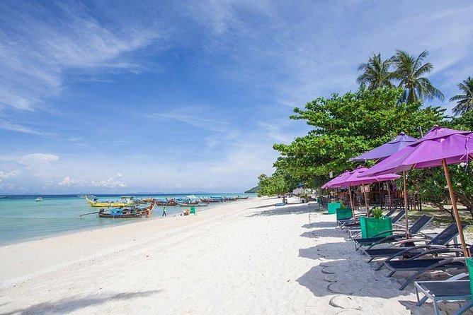 Phi Phi Islands Premium Trip By Royal Jet Cruiser and Speedboat From Phuket - Phi Phi Ley’s limestone coves from the water