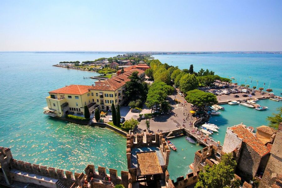 Sirmione: Walking and Speedboat Tour - Crossing the bridge into Sirmione’s old town