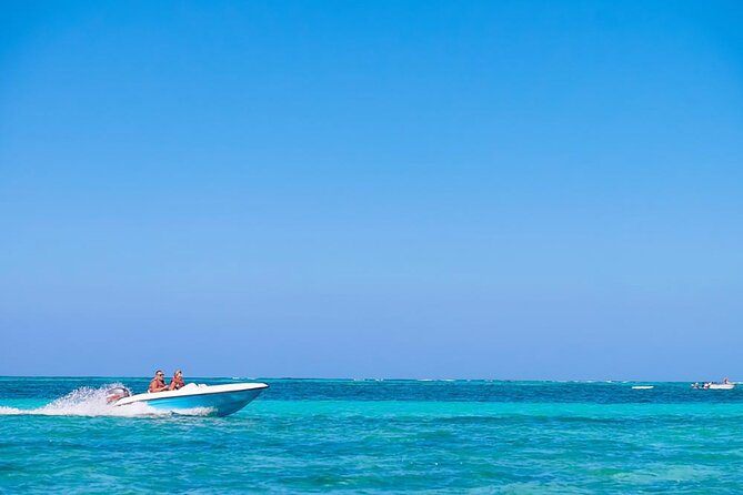 Speed Boat Activity with Snorkeling and Parasailing in Punta Cana - Parasailing above Punta Cana’s Caribbean water