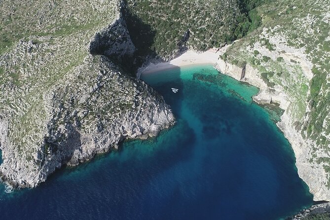 Speed Boat Tour to Vlore's Secret Blue Cave at Grama Bay - Englishman Bay offers clear water and tall cliffs