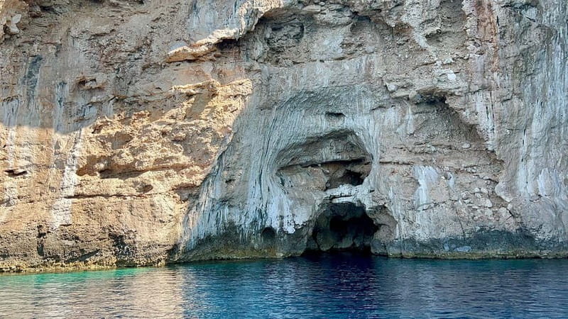 Vlore: Dafina Cave & Haxhi Ali Cave Speedboat Guided Tour - Bristan Bay adds bunkers to the beach day